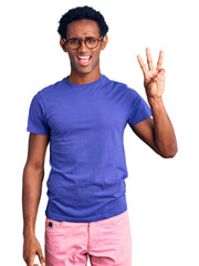 Wall Mural - African handsome man wearing casual clothes and glasses showing and pointing up with fingers number three while smiling confident and happy.