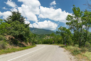 An old European road in the mountains along the rocks. Coast of the Black Sea.