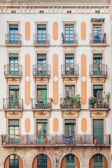 Facade of a typical Barcelona building. Residential building with balconies and windows. Colorful apartment buildings. windows and balconies. Buildings architecture in Europe