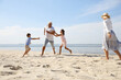 © New Africa - Cute little children with grandparents spending time together on sea beach