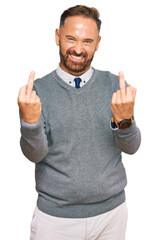 Poster - Handsome middle age man wearing business clothes showing middle finger doing fuck you bad expression, provocation and rude attitude. screaming excited