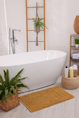 Canvas Print - Stylish bathroom interior with soft bath mat and tub