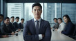 © S photographer - A young Asian businessman is posing confidently in a conference room.