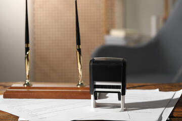 Wall Mural - Notary contract. Stamp, documents and pen holder on wooden table