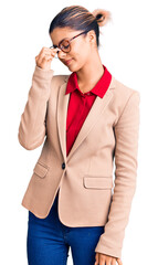 Poster - Young beautiful woman wearing business shirt and glasses tired rubbing nose and eyes feeling fatigue and headache. stress and frustration concept.