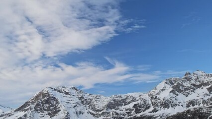 Wall Mural - Moving clouds in the sky over the Central Alps