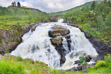 Wall Mural - Voringsfossen waterfall at the top of the Mabodalen valley in the municipality of Eidfjord, Norway