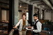© Marko Geber - Businesswoman discussing with waiter in modern hotel restaurant