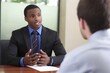 a young man being interviewed for a job