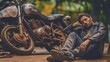 Man on Motorcycle Resting After Accident. Biker man and motorcycle,Young man rider trendy motorbik had stopped to rest during the trip to see the light of nature,