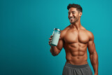 Fototapeta  - Healthy lifestyle: Handsome bodybuilder with a shaker bottle, promoting fitness and diet.