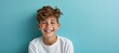 © Ilja - Smiling caucasian boy model with perfect teeth on blue background for ads and web design