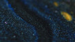 Sparkling ink spill. Paint drip. Glitter cascade. Defocused blue black golden color shiny particles texture fluid flow motion on dark abstract art background.