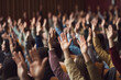 © pkproject - Cheers in class, Close up view of hands expressing enthusiasm in a lecture hall.