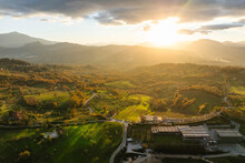 Aerial View Of A Mountains And Hills Landscape With Vineyard And Countryside Houses At Sunset In Autumn Colours, Irpinia, Avellino, Campania, Italy.