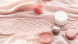  a close up of a bottle of cream and a container of lip balm on a pink sheeted surface.