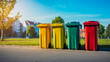 Colourful recycling waste bins outdoors in city in summer.