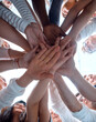 © ASDF - bottom view . group of young people joining their palms together