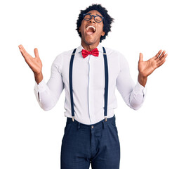 Sticker - Handsome african american man with afro hair wearing hipster elegant look celebrating mad and crazy for success with arms raised and closed eyes screaming excited. winner concept