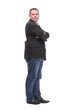 © ASDF - Side view of confident businessman with arms folded against white background
