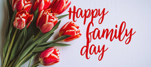 Happy Family Day Written With Red Marker On Joyful Colorful Flowers Background