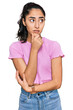 © Krakenimages.com - Hispanic teenager girl with dental braces wearing casual clothes thinking worried about a question, concerned and nervous with hand on chin