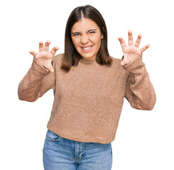 Canvas Print - Young beautiful woman wearing casual clothes smiling funny doing claw gesture as cat, aggressive and sexy expression