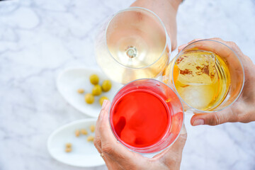 toast with soft drinks on the terrace of a bar with olives