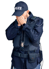 Wall Mural - Young handsome man wearing police uniform with sad expression covering face with hands while crying. depression concept.