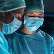 © Acronym - Team of medical doctors performs surgical operation in modern operating room using high-tech technology. Surgeons are working to save the patient in the hospital. Medicine, health and science.
