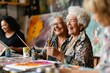 © Areesha - Senior lady artist enjoying painting activity in studio with her friends