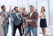 © ASDF - happy young business man accepting congratulations from his colleagues.