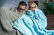 © Nenad - Couple suffering cold at home and problem with house heating