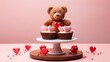  a teddy bear sitting on top of a cupcake on top of a cake stand with hearts on the bottom of the cupcakes.