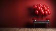  a table with a bunch of red balloons on it and a bunch of red flowers on top of it in front of a red wall.