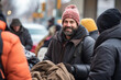 Volunteers distributing warm blankets and essentials to homeless individuals during the winter season, providing comfort and warmth.