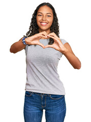 Poster - Young african american girl wearing casual clothes smiling in love doing heart symbol shape with hands. romantic concept.