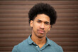 © mimagephotos - serious young guy with afro