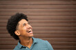 © mimagephotos - cheerful young man with afro