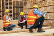 © ultramansk - workers man and woman engineering sitting and inspecting with working suite dress and hand glove in the front machine. Concept of smart industry worker operating. Wood factories produce wood timber.