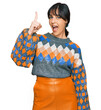 © Krakenimages.com - Young hispanic woman wearing casual clothes pointing finger up with successful idea. exited and happy. number one.