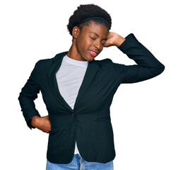 Wall Mural - Young african american girl wearing business clothes stretching back, tired and relaxed, sleepy and yawning for early morning