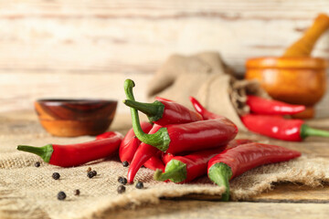 Wall Mural - Heap of fresh chili peppers on table