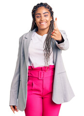 Canvas Print - Young african american woman with braids wearing business clothes smiling friendly offering handshake as greeting and welcoming. successful business.