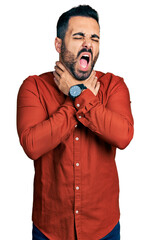 Sticker - Young hispanic man with beard wearing casual shirt shouting suffocate because painful strangle. health problem. asphyxiate and suicide concept.