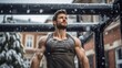 Handsome young man with big muscular and vascular arms, attractive and fit youthful male model working out outdoors in the calisthenics or street workout park, snow falling, strong winter athlete