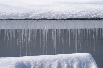 Wall Mural - winter house with icicle and snow on the roof