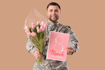 Canvas Print - Male soldier with tulips and greeting card on brown background. International Women's Day celebration