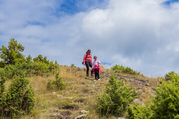 Wall Mural - Family Hiking Adventure in Mountain Landscape