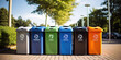 Collection of waste bins full of different types of garbage, recycling and separate waste collection concept. Recycling bins on city street.
